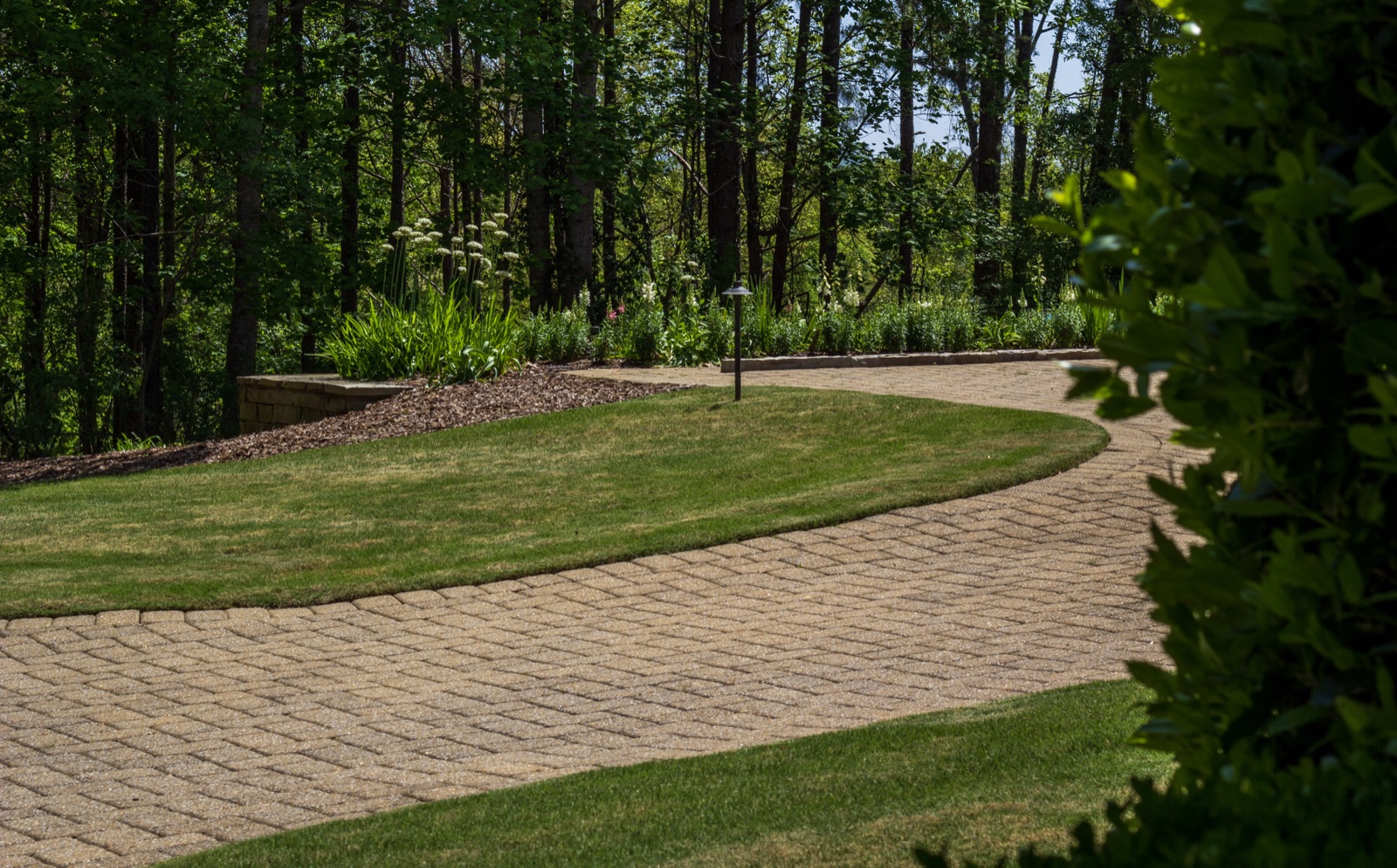 Custom hardscape pathway through wooded property